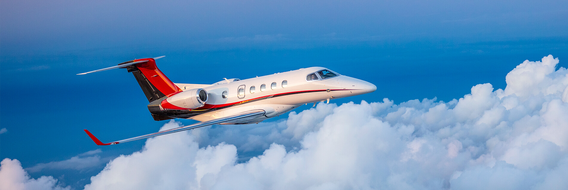 Embraer Phenom 300 in Clouds