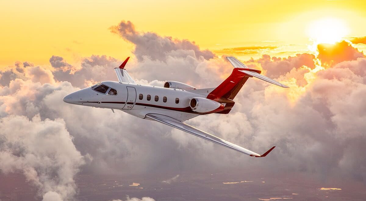 Embraer Phenom 300E Aerial with Sunset in Background