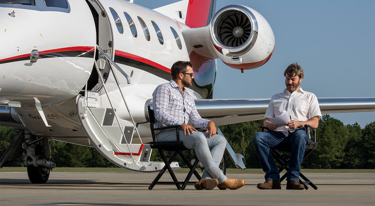 Peder von Harten Being Interviewed in front of Phenom 300E