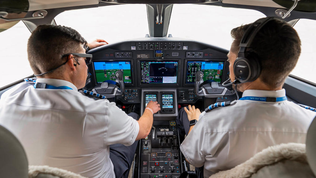 Nicholas Air Pilots Sitting in a Cockpit