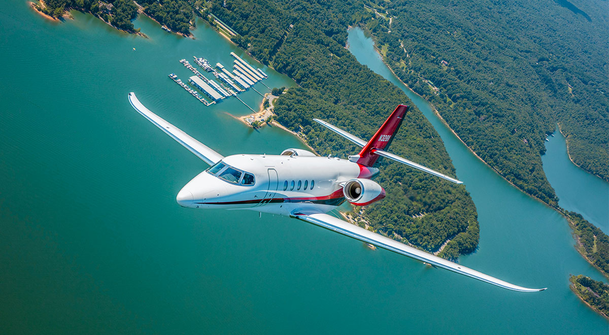 Cessna Citation Latitude Flying Above a Lake